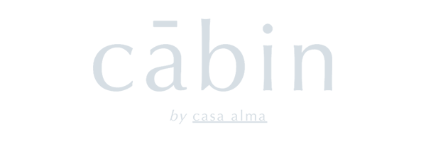 Text logo with the word "cabin" in lowercase, followed by the phrase "by casa alma" in smaller text below, crafted by a Web Design Agency Toronto. Conte Studios