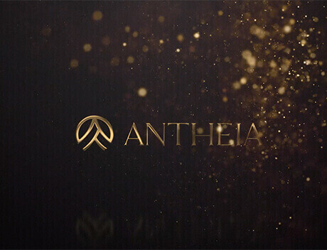 The image features a gold logo and the text "ANTHEIA" against a dark backdrop with scattered light particles, capturing the essence of Conte Studios, a premier Web Design Agency in Toronto. Conte Studios