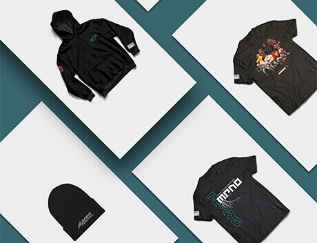 A curated collection of clothing items—a black hoodie, two graphic T-shirts, and a black beanie—artfully arranged on a teal and white background. This display reflects the creative touch of a Toronto Design Agency to elevate style through striking visuals. Conte Studios