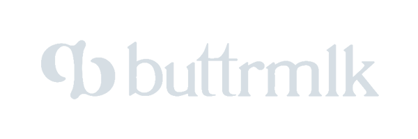 Stylized text logo reads "buttrmlk" with a decorative "B" on the left, representing a creative collaboration by Toronto Design Agency. Conte Studios