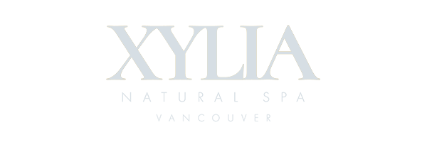 Logo for Xylia Natural Spa, Vancouver, crafted by the expert team at Conte Studios. It features the business name in capital letters on a transparent background. Conte Studios